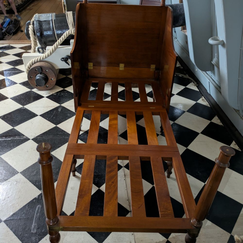 Vice Admiral Lord Nelson's wooden bed with all the bedding removed. 
