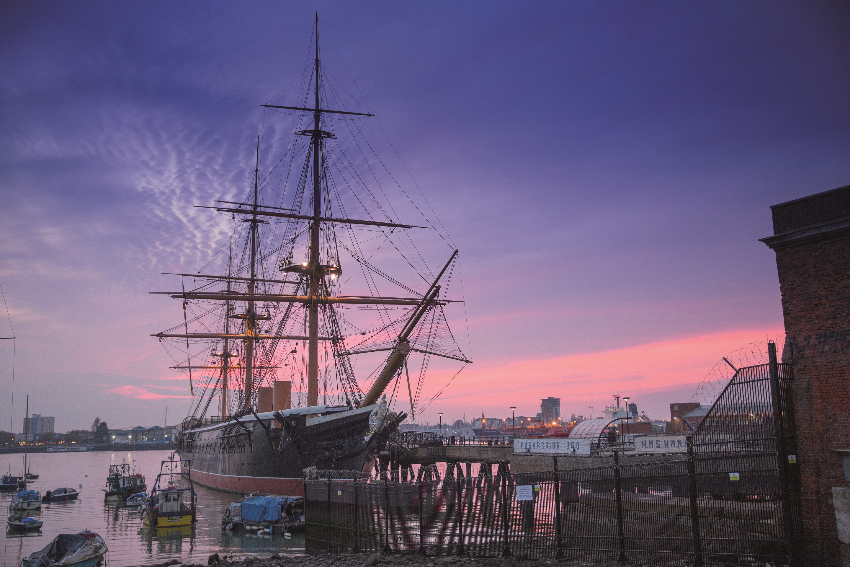 HMS Warrior 1860 at dusk at Portsmouth Historic Dockyard.