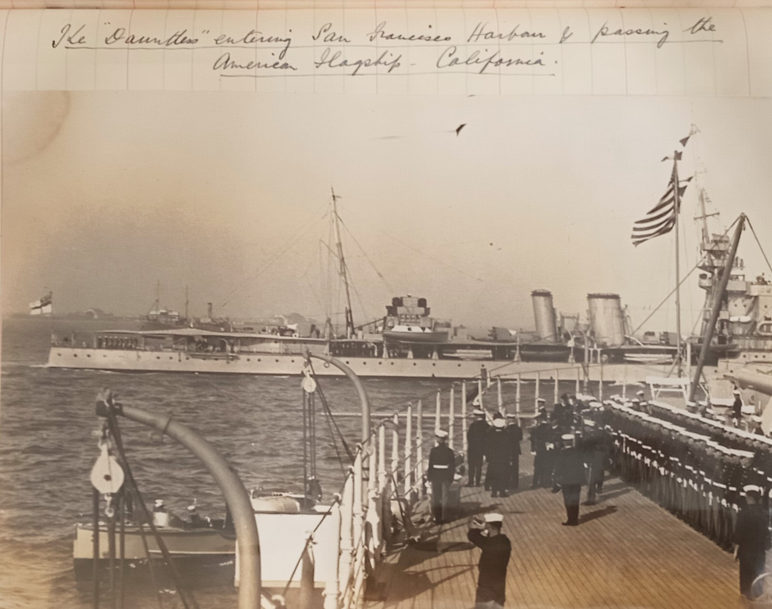HMS Dauntless passing USS California at sea. 