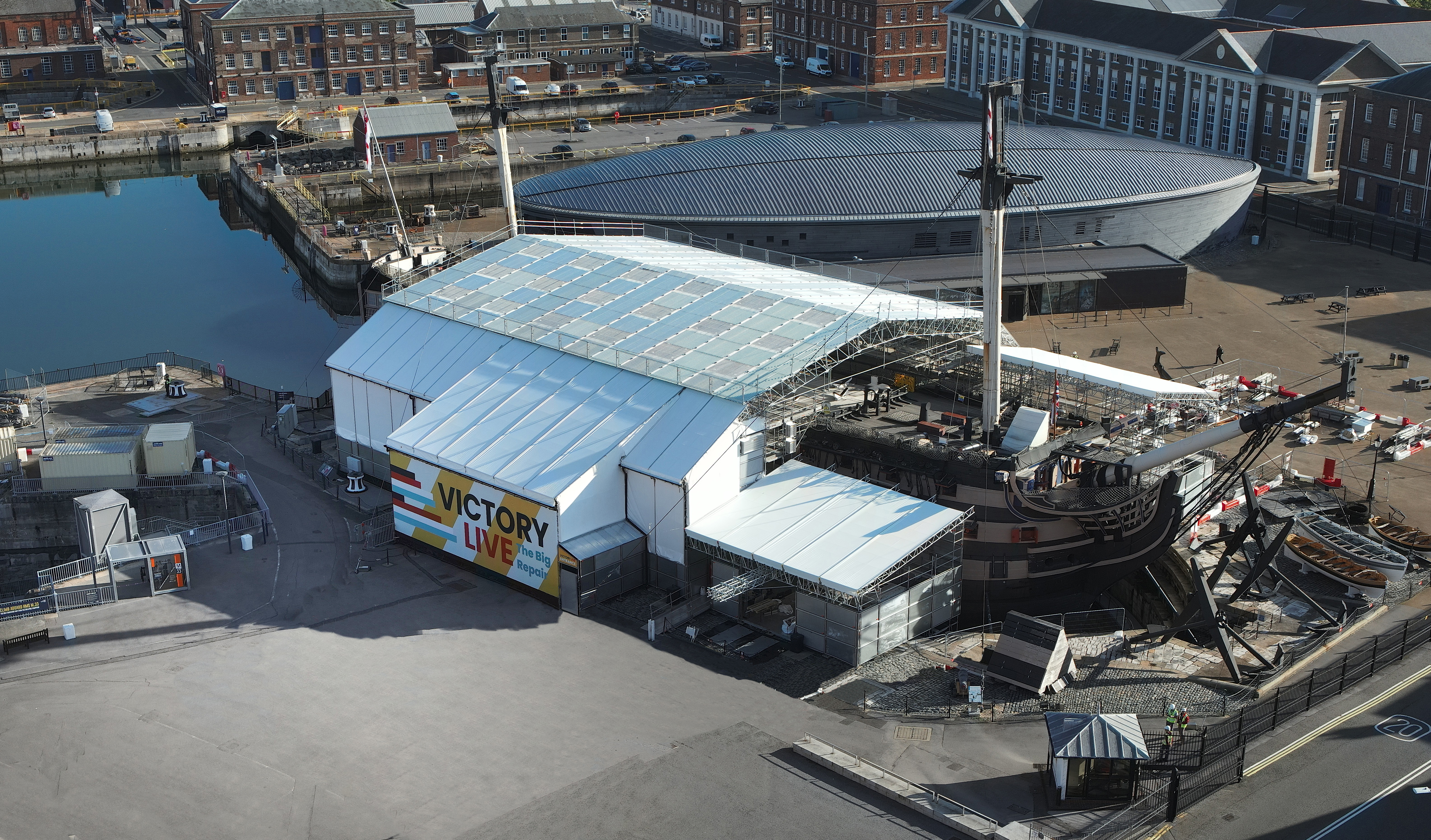 HMS Victory is covered by a tent to enable conservation works. 