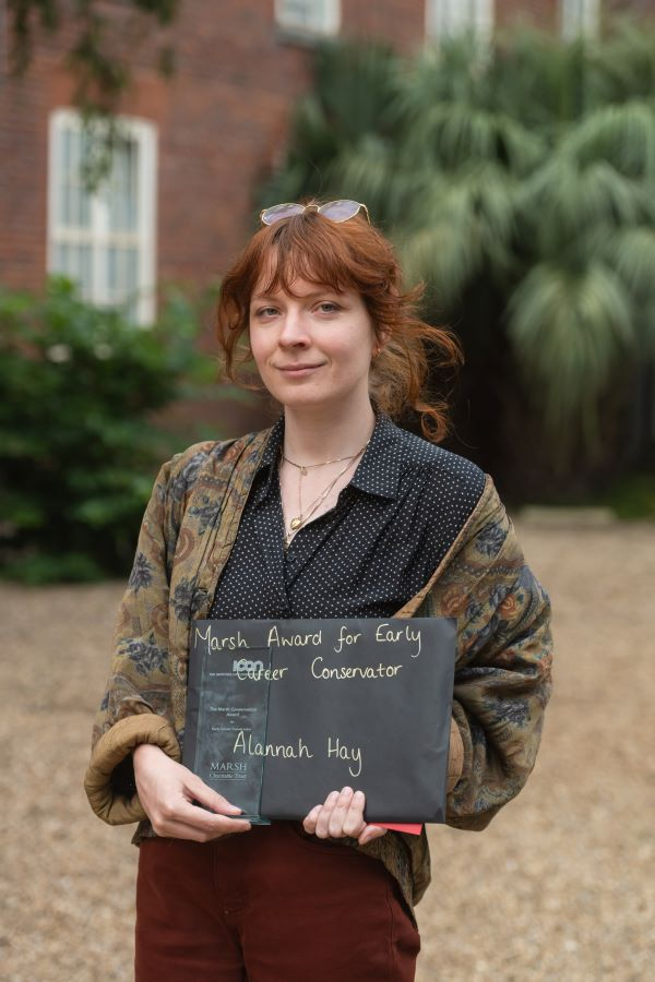 Alannah Hay holding her award. 