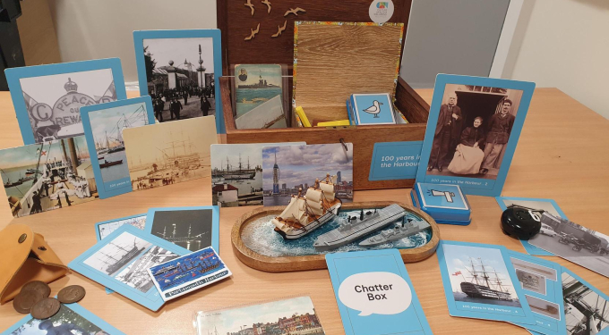 A box full of nautical items open on a table. 