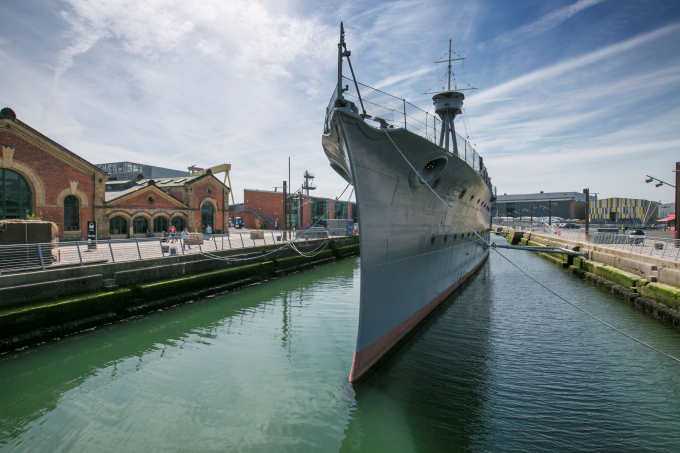 Exterior of HMS Caroline at dock in Belfast's maritime mile.