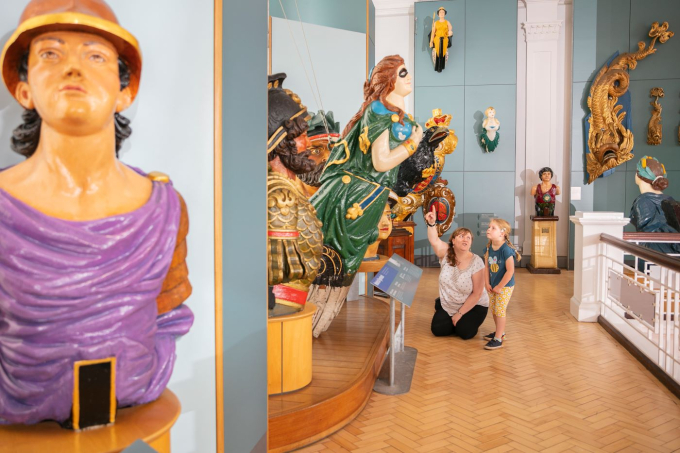 A collection of the colourful figureheads on display in the Victory Gallery.  