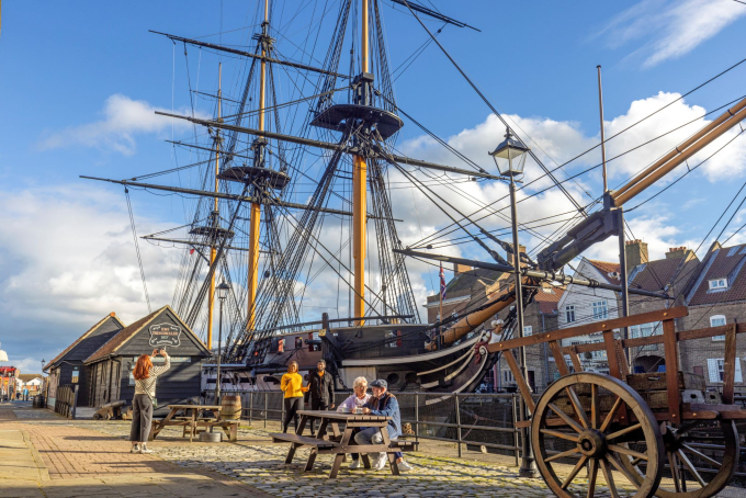 Visitors enjoying the Georgian Quayside with HMS Trincomalee in the background. 
