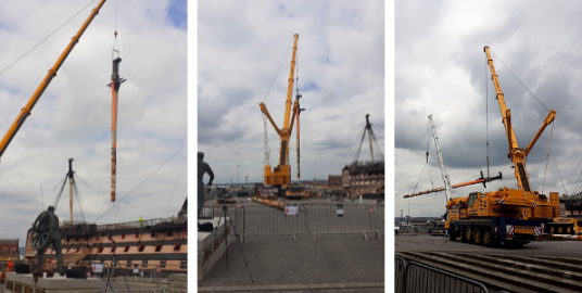 HMS Victory's masts being removed by crane. 