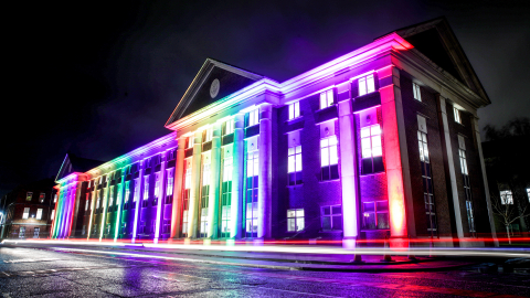 Royal Navy building lit up with rainbow lights. 