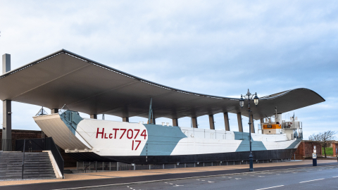 LCT 7074 D-Day landing craft on display under a canopy shelter in Portsmouth