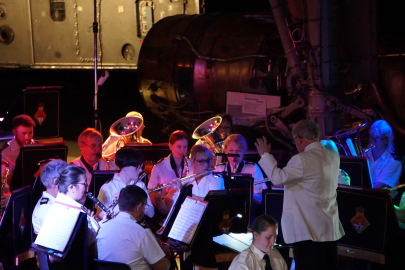 Band playing Christmas songs underneath Concorde