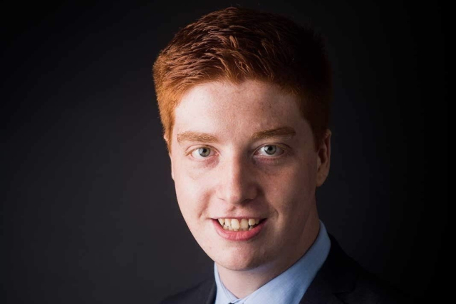 Ellis Ryan is male, Caucasian, and has red hair. 