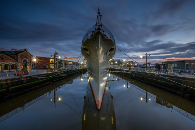 Exterior of HMS Caroline at night