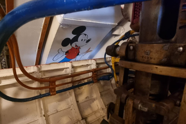 Cartoon of Mickey Mouse painted onto HMS Alliance's wall. 