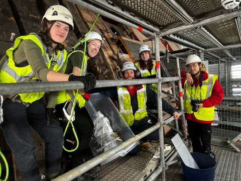 team of archaeologist on scaffolding of HMS victory