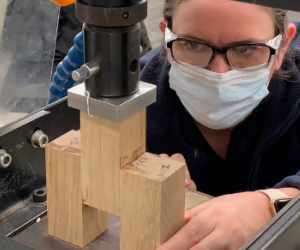 An engineer testing building materials in a lab. 