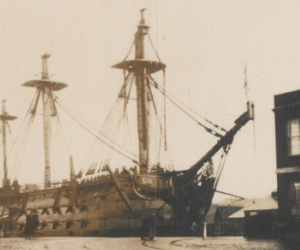 HMS Victory in drydock at Portsmouth with partial masts. 