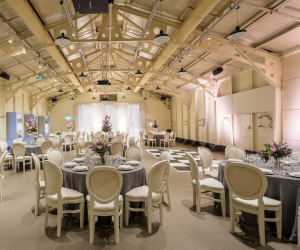 Tables and chairs set up for a celebration onboard HMS Caroline.