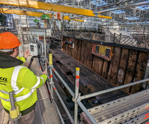 A conservator laser scanning images for the 3D model of HMS Victory.