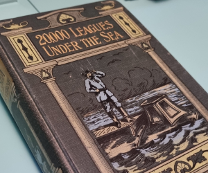 A book of 20,000 Leagues Under the Sea with an illustrated cover showing Captain Nemo. 