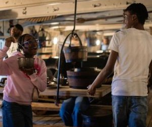 Children having fun exploring HMS Victory's gun deck. 