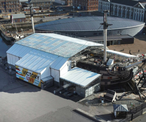 HMS Victory covered in Victory Live scaffolding. 