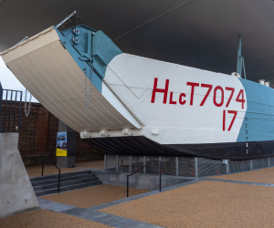 LCT 7074 D-Day landing craft on display under a canopy shelter in Portsmouth