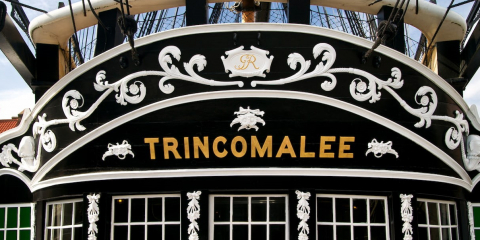 The lettered nameplate for HMS Trincomalee found across her stern. 