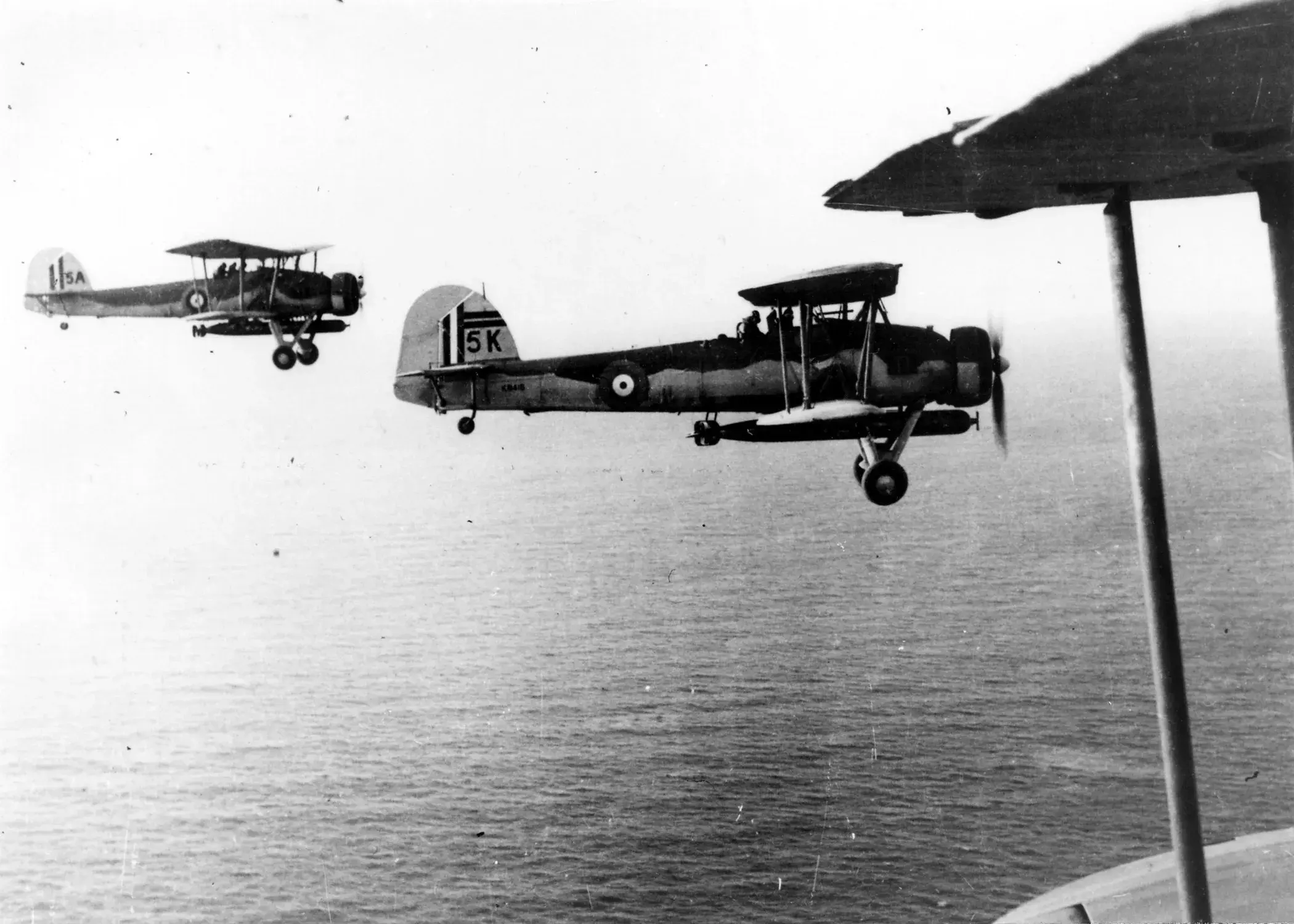 Two Fairey Swordfish airplanes flying next to each other. 