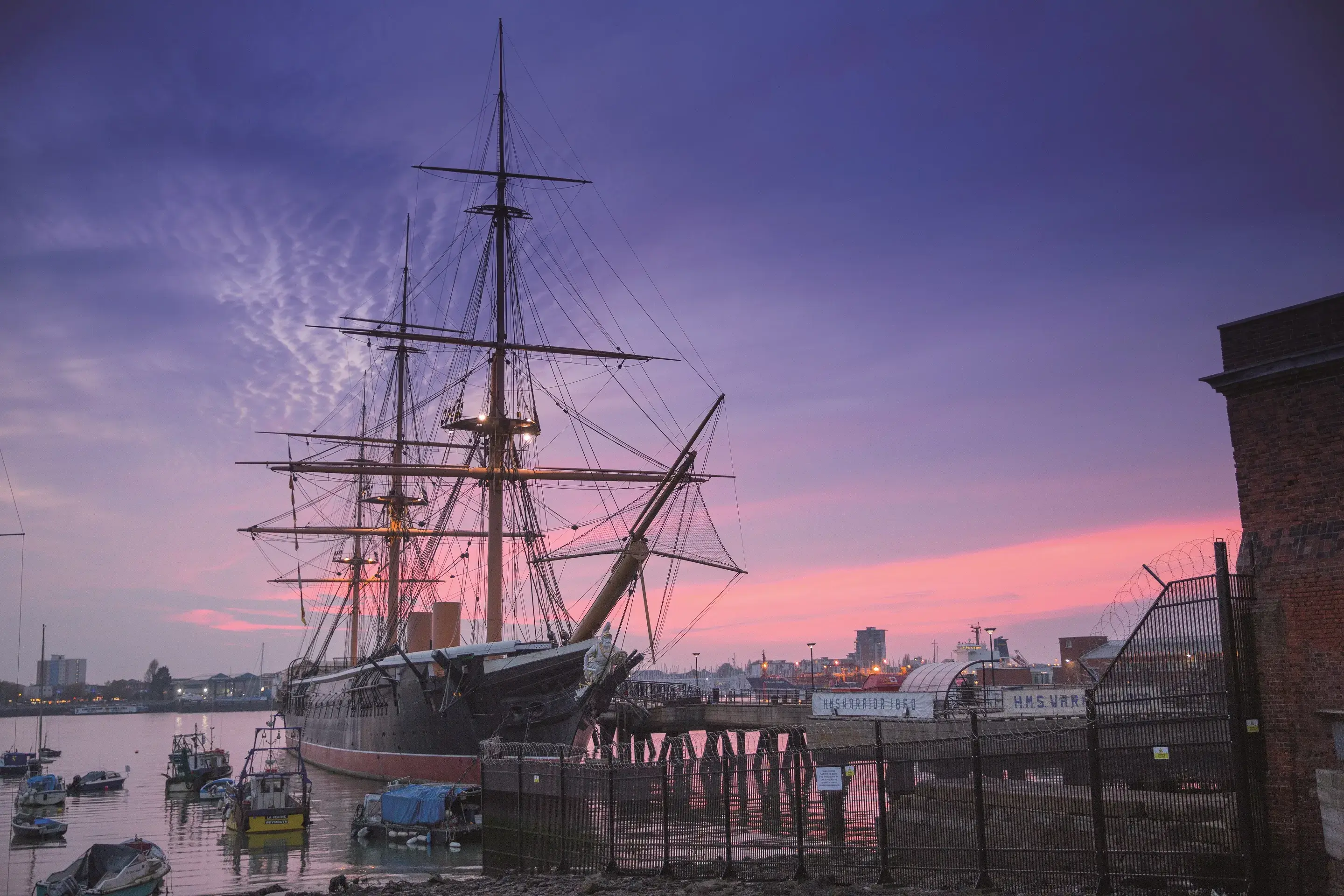 HMS Warrior 1860 at dusk at Portsmouth Historic Dockyard.
